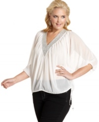 Sparkle from day to night with Baby Phat's three-quarter-sleeve plus size top, accented by a beaded neckline. Sparkle from day to night with Baby Phat's three-quarter-sleeve plus size top, accented by a beaded neckline.