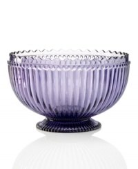 Past meets present. Feminine scalloped edges and fluted detail in amethyst-hued glass make this Modern Vintage serving bowl a standout at the table and on display. From the Godinger serveware collection. Past meets present. Feminine scalloped edges and fluted detail in amethyst-hued glass make this Modern Vintage serving bowl a standout at the table and on display. From the Godinger serveware collection.