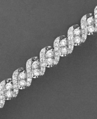 Seemingly endless diamonds enrapture and enthrall on this stunning diamond bracelet. Round-cut diamonds (5 ct. t.w.) set in 14k white gold. Approximate length: 7-1/4 inches. Seemingly endless diamonds enrapture and enthrall on this stunning diamond bracelet. Round-cut diamonds (5 ct. t.w.) set in 14k white gold. Approximate length: 7-1/4 inches.