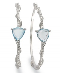 Ordinary hoops get a glamorous update. Victoria Townsend's shimmery style combines trilliant-cut blue topaz (6 ct. t.w.) and sparkling diamond accents in sterling silver. Approximate diameter: 1-3/4 inches. Ordinary hoops get a glamorous update. Victoria Townsend's shimmery style combines trilliant-cut blue topaz (6 ct. t.w.) and sparkling diamond accents in sterling silver. Approximate diameter: 1-3/4 inches.