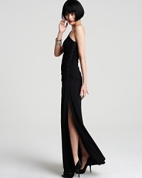 Opt for simple, modern elegance in this one-shoulder gown from Laundry by Shelli Segal. Sparkling beadwork decorates one side. Opt for simple, modern elegance in this one-shoulder gown from Laundry by Shelli Segal. Sparkling beadwork decorates one side.