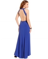 Don belle-of-the-ball style in this floor-sweeping gown that boasts intricate beading and a sexy, open-back design! From Morgan. Don belle-of-the-ball style in this floor-sweeping gown that boasts intricate beading and a sexy, open-back design! From Morgan.
