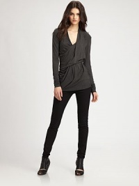 An ideal layering piece, this stretchy jersey top has a slouchy crossover v-neck and asymmetrical draping. Draped crossover v-neckLong sleevesAsymmetrical back hem hits below the hips94% rayon/6% spandexDry cleanMade in USAModel shown is 5'9½ (176cm) wearing US size Small. An ideal layering piece, this stretchy jersey top has a slouchy crossover v-neck and asymmetrical draping. Draped crossover v-neckLong sleevesAsymmetrical back hem hits below the hips94% rayon/6% spandexDry cleanMade in USAModel shown is 5'9½ (176cm) wearing US size Small.