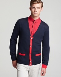 Spun in a regal blend of silk, cotton and cashmere for uncommon softness, this cardigan features alternating contrast trim for a lighthearted, whimsical design you'll wear to the new wine bar downtown. Spun in a regal blend of silk, cotton and cashmere for uncommon softness, this cardigan features alternating contrast trim for a lighthearted, whimsical design you'll wear to the new wine bar downtown.