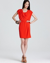 Bold color leads the way this season. Take charge of the trend in this DKNYC dress, a vibrantly decadent hue ignites an elegantly draped silhouette for a blazing fashion statement. Bold color leads the way this season. Take charge of the trend in this DKNYC dress, a vibrantly decadent hue ignites an elegantly draped silhouette for a blazing fashion statement.