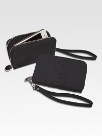 Trim and elegant, this zip-around design of python-embossed leather is just the right size to hold your phone, a credit card, a little cash and a key or two, so it's perfect for a pared-down night on the town.ul> HandcraftedZip-around designDetachable wrist strapCell phone pocketTwo inside card slotsInside currency pocketInside zip change pocket5½L X 3¼WImported Trim and elegant, this zip-around design of python-embossed leather is just the right size to hold your phone, a credit card, a little cash and a key or two, so it's perfect for a pared-down night on the town.ul> HandcraftedZip-around designDetachable wrist strapCell phone pocketTwo inside card slotsInside currency pocketInside zip change pocket5½L X 3¼WImported