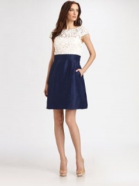 Beautifully crocheted lace meets lustrous silk, in this elegant style.Jewel necklineCap sleevesBanded waistSide slash pocketsConcealed back zipFully linedAbout 24 from natural waistBodice: polyesterSkirt: silkDry cleanImportedModel shown is 5'10½ (179cm) wearing US size 4. Beautifully crocheted lace meets lustrous silk, in this elegant style.Jewel necklineCap sleevesBanded waistSide slash pocketsConcealed back zipFully linedAbout 24 from natural waistBodice: polyesterSkirt: silkDry cleanImportedModel shown is 5'10½ (179cm) wearing US size 4.