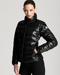 In rich burgundy and a lacquered finish, this classic Moncler puffer keeps out the cold in French aprés ski style. In rich burgundy and a lacquered finish, this classic Moncler puffer keeps out the cold in French aprés ski style.
