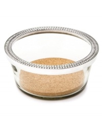 Arthur Court gives your table a stylish edge that's also eco friendly with the Perla wine caddy, featuring recycled glass trimmed in beaded aluminum. Arthur Court gives your table a stylish edge that's also eco friendly with the Perla wine caddy, featuring recycled glass trimmed in beaded aluminum.