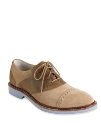 With a contrast upper and bright pops of color, this stepped-up saddle shoe from Cole Haan features concealed NIKE AIR technology for maximum comfort. With a contrast upper and bright pops of color, this stepped-up saddle shoe from Cole Haan features concealed NIKE AIR technology for maximum comfort.