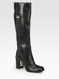 A tall and sleek design rendered in supple leather with logoed hardware. Self-covered heel with a metal insert, 3½ (90mm)Shaft, 15½Leg circumference, 14Leather upperPartial side zipPull-on styleLeather liningLeather and rubber solePadded insoleImported A tall and sleek design rendered in supple leather with logoed hardware. Self-covered heel with a metal insert, 3½ (90mm)Shaft, 15½Leg circumference, 14Leather upperPartial side zipPull-on styleLeather liningLeather and rubber solePadded insoleImported