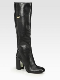 A tall and sleek design rendered in supple leather with logoed hardware. Self-covered heel with a metal insert, 3½ (90mm)Shaft, 15½Leg circumference, 14Leather upperPartial side zipPull-on styleLeather liningLeather and rubber solePadded insoleImported