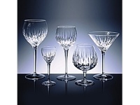 This popular pattern, inspired by the creative energy of the New York artist neighborhood, features a generous bowl adorned by a brilliant contemporary cutting. The delicately etched stemware adds a graceful note to any gathering. Shown left to right: goblet, wine, flute, iced beverage.