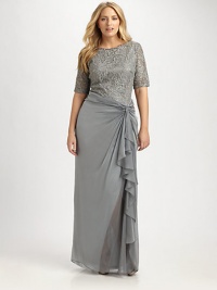 The essence of glamour, this stunning design features elbow-length sleeves to give you exquisite arm coverage and lovely lace for an undeniably romantic look.Round neckElbow-length sleevesCascading ruffles along side of skirtConcealed back zipperAbout 46 from natural waistFully lined50% nylon/50% rayonDry cleanImported The essence of glamour, this stunning design features elbow-length sleeves to give you exquisite arm coverage and lovely lace for an undeniably romantic look.Round neckElbow-length sleevesCascading ruffles along side of skirtConcealed back zipperAbout 46 from natural waistFully lined50% nylon/50% rayonDry cleanImported