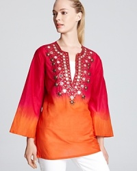 Ablaze with a rush of fiery hues and finished with gleaming mirrored accents, this MICHAEL Michael Kors tunic ignites your off-duty look. Let the vibrant style shine against white denim. Ablaze with a rush of fiery hues and finished with gleaming mirrored accents, this MICHAEL Michael Kors tunic ignites your off-duty look. Let the vibrant style shine against white denim.