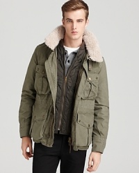 The shearling collar adds a rugged touch to this strong design from Burberry Brit, a handsome outer layer that works virtually anywhere you travel. Note the main jacket detaches from the interior for a lighter weight look when the sun picks up. The shearling collar adds a rugged touch to this strong design from Burberry Brit, a handsome outer layer that works virtually anywhere you travel. Note the main jacket detaches from the interior for a lighter weight look when the sun picks up.