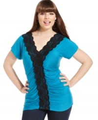 Lace lends a sassy look to ING's short sleeve plus size top, finished by a ruched front-- it's a must-have! Lace lends a sassy look to ING's short sleeve plus size top, finished by a ruched front-- it's a must-have!