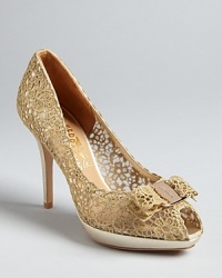 Lace lends an air of exceptional elegance to these Salvatore Ferragamo platform pumps. For the perfect finishing touch, the intricate material is carried into signature logo bow details. Lace lends an air of exceptional elegance to these Salvatore Ferragamo platform pumps. For the perfect finishing touch, the intricate material is carried into signature logo bow details.