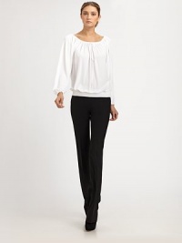 This ultra-flattering blouson style can be worn on or off the shoulder, thanks to an adjustable drawstring neckline.Drawstring portrait neckline with front self tieLong blouson sleeves with gathered cuffsSmocked, elastic hemlineViscoseDry cleanImported of Italian fabricModel shown is 5'11 (180cm) wearing US size 4. This ultra-flattering blouson style can be worn on or off the shoulder, thanks to an adjustable drawstring neckline.Drawstring portrait neckline with front self tieLong blouson sleeves with gathered cuffsSmocked, elastic hemlineViscoseDry cleanImported of Italian fabricModel shown is 5'11 (180cm) wearing US size 4.