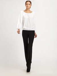 This ultra-flattering blouson style can be worn on or off the shoulder, thanks to an adjustable drawstring neckline.Drawstring portrait neckline with front self tieLong blouson sleeves with gathered cuffsSmocked, elastic hemlineViscoseDry cleanImported of Italian fabricModel shown is 5'11 (180cm) wearing US size 4. 