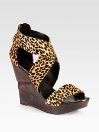 Architectural, wooden wedge topped with leopard-print calf hair straps and an exposed back zipper. Wooden wedge, 4½ (115mm)Wooden platform, 1 (25mm)Compares to a 3½ heel (90mm)Leopard-print calf hair upperBack zipperLeather liningRubber solePadded insoleImportedOUR FIT MODEL RECOMMENDS ordering true size. Architectural, wooden wedge topped with leopard-print calf hair straps and an exposed back zipper. Wooden wedge, 4½ (115mm)Wooden platform, 1 (25mm)Compares to a 3½ heel (90mm)Leopard-print calf hair upperBack zipperLeather liningRubber solePadded insoleImportedOUR FIT MODEL RECOMMENDS ordering true size.