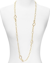 This simply styled Alexis Bittar necklace works an easy elegance cast in gold tone plated metal with striking Swarovski crystal stations, specially faceted for added allure. This simply styled Alexis Bittar necklace works an easy elegance cast in gold tone plated metal with striking Swarovski crystal stations, specially faceted for added allure.