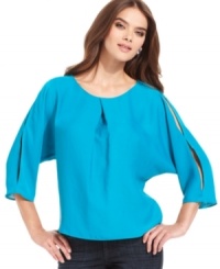 Cutout details up the edge on this boxy RACHEL Rachel Roy blouse for an urban-chic look! Cutout details up the edge on this boxy RACHEL Rachel Roy blouse for an urban-chic look!