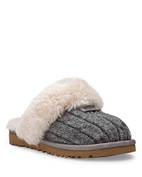 These cable knit slippers will keep her cozy at home with genuine shearling lining and cuff. These cable knit slippers will keep her cozy at home with genuine shearling lining and cuff.