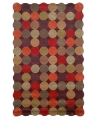 A series of colorful circles stand side-by-side to create a striking field of reds, maroons and greens. This room-changing rug features a unique, wavy edge, comprised of the collective curves of the outer circles, bringing a modern touch to any room in your home. A series of colorful circles stand side-by-side to create a striking field of reds, maroons and greens. This room-changing rug features a unique, wavy edge, comprised of the collective curves of the outer circles, bringing a modern touch to any room in your home.