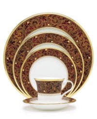 Add drama to your tabletop with this bold pattern from Noritake! Strikingly elegant, this bone china features a rich gold and red brocade border adorned with soft ivory dots and a gold band. Fruit bowl not shown.