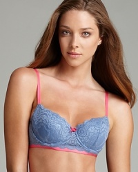 An allover lace bra with contrasting ribbon trim and bow at the center front. Style #E72-835 An allover lace bra with contrasting ribbon trim and bow at the center front. Style #E72-835