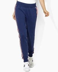 In celebration of the 2012 Olympic Games, a skinny-fitting sweatpant is designed from super-soft fleece with sleek, athletic-inspired stripes down the sides. In celebration of the 2012 Olympic Games, a skinny-fitting sweatpant is designed from super-soft fleece with sleek, athletic-inspired stripes down the sides.