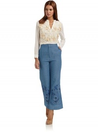 THE LOOKFront floral embroidered appliquéV-slit at neckLong sleeves with barrel cuffsTHE FITAbout 22 from shoulder to hemTHE MATERIALSilkCARE & ORIGINDry cleanImportedModel shown is 5'10 (177cm) wearing US size 4. THE LOOKFront floral embroidered appliquéV-slit at neckLong sleeves with barrel cuffsTHE FITAbout 22 from shoulder to hemTHE MATERIALSilkCARE & ORIGINDry cleanImportedModel shown is 5'10 (177cm) wearing US size 4.