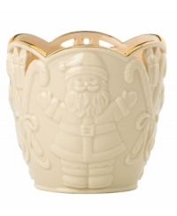 Combining elegant cutwork, gold trim and St. Nick in ivory porcelain, this Merry Lights candle holder shines a light on Christmas. Combining elegant cutwork, gold trim and St. Nick in ivory porcelain, this Merry Lights candle holder shines a light on Christmas.