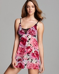 Slip into something sultry. Betsey Johnson's knit chiffon babydoll features a vibrate floral print and sheer lace detail. Slip into something sultry. Betsey Johnson's knit chiffon babydoll features a vibrate floral print and sheer lace detail.