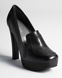 A loafer silhouette is equipped with a rich mahogany sole and dressed up with stitched details. From Calvin Klein. A loafer silhouette is equipped with a rich mahogany sole and dressed up with stitched details. From Calvin Klein.