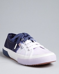 With a fading ombré design, Superga's classic canvas sneakers get a tie-dyed makeover. With a fading ombré design, Superga's classic canvas sneakers get a tie-dyed makeover.