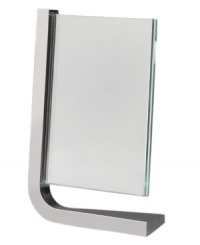 Cast your friends and family members in this modern Movie frame. One rounded corner forged in gleaming Nambé alloy suspends plates of glass -- and your photo -- in a vertical direction. Designed by Neil Cohen. Cast your friends and family members in this modern Movie frame. One rounded corner forged in gleaming Nambé alloy suspends plates of glass -- and your photo -- in a vertical direction. Designed by Neil Cohen.
