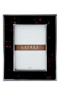 The alluring beauty of multi-faceted Tortoise shell finish presents a warm accent to clean stainless steel in this refined picture frame from Lauren by Ralph Lauren. The alluring beauty of multi-faceted Tortoise shell finish presents a warm accent to clean stainless steel in this refined picture frame from Lauren by Ralph Lauren.