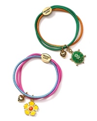 From Juicy Couture, darling hair elastics, bundled in groups of three and adorned with a heart and flower or turtle charms. From Juicy Couture, darling hair elastics, bundled in groups of three and adorned with a heart and flower or turtle charms.
