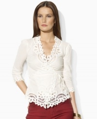 Steeped in vintage inspiration, Lauren by Ralph Lauren's delicate petite wrap top is rendered in woven cotton and accented with lace detailing along the neckline, cuffs and hem. Steeped in vintage inspiration, Lauren by Ralph Lauren's delicate petite wrap top is rendered in woven cotton and accented with lace detailing along the neckline, cuffs and hem.
