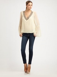 Lustrous beads trim the neckline of this filmy silk topper for instant romance.V necklineGathered bell sleevesFlared cuffsAbout 26 from shoulder to hemSilkDry cleanImported Lustrous beads trim the neckline of this filmy silk topper for instant romance.V necklineGathered bell sleevesFlared cuffsAbout 26 from shoulder to hemSilkDry cleanImported