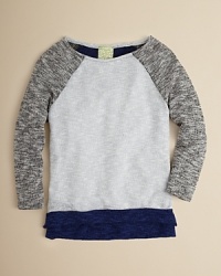 A raglan sleeve layering piece for the chilly months, this slouchy sweater is rendered in a soft, marled knit. A raglan sleeve layering piece for the chilly months, this slouchy sweater is rendered in a soft, marled knit.